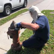 Chief Conley Refurbishing Hydrant